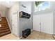 Bright entryway with tiled floors, a coat rack, and a bench at 12666 Moss Park Ridge Dr, Orlando, FL 32832