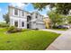 Two-story home with gray siding and landscaping at 12666 Moss Park Ridge Dr, Orlando, FL 32832