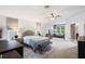 Spacious main bedroom with sitting area and ensuite bathroom at 12666 Moss Park Ridge Dr, Orlando, FL 32832