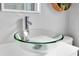 Bathroom featuring a stylish glass vessel sink and chrome faucet at 136 Madiera Beach Blvd, Kissimmee, FL 34746