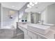 Elegant bathroom with a soaking tub, walk-in shower, and modern vanity at 136 Madiera Beach Blvd, Kissimmee, FL 34746