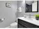 Modern bathroom with vanity, toilet and shower at 136 Madiera Beach Blvd, Kissimmee, FL 34746