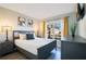 Comfortable bedroom with a queen-size bed and plenty of natural light at 136 Madiera Beach Blvd, Kissimmee, FL 34746