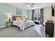 Bright bedroom with king-size bed, stylish decor, and large window at 136 Madiera Beach Blvd, Kissimmee, FL 34746