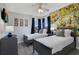 Twin bedroom with comic book wall mural and gray platform beds at 136 Madiera Beach Blvd, Kissimmee, FL 34746