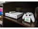 Xbox and controller on shelf at 136 Madiera Beach Blvd, Kissimmee, FL 34746