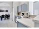 Modern kitchen with stainless steel appliances and a breakfast bar at 136 Madiera Beach Blvd, Kissimmee, FL 34746