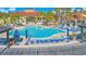 Resort-style pool with plenty of lounge chairs and umbrellas at 136 Madiera Beach Blvd, Kissimmee, FL 34746