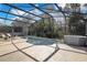 Inviting pool and spa with screened enclosure, perfect for relaxation at 136 Madiera Beach Blvd, Kissimmee, FL 34746