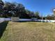 Large backyard with a shed, a fence and some trees at 14476 Se 34Th Ct, Summerfield, FL 34491