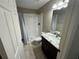Bathroom with shower, granite countertop, and toilet at 14476 Se 34Th Ct, Summerfield, FL 34491