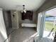 Bright dining area with tile flooring and access to the backyard at 14476 Se 34Th Ct, Summerfield, FL 34491