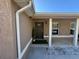 House exterior featuring a dark brown front door at 14476 Se 34Th Ct, Summerfield, FL 34491