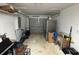 Garage with extra storage and a motorcycle at 14476 Se 34Th Ct, Summerfield, FL 34491