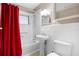 Clean bathroom, featuring a bathtub, sink, and toilet at 149 Lakewood Dr, Debary, FL 32713