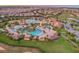 Resort-style community with pools, clubhouse, and lush landscaping at 1584 Sandbagger Dr, Davenport, FL 33896