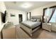 Spacious bedroom with king-size bed and en-suite bathroom access at 1584 Sandbagger Dr, Davenport, FL 33896