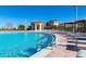 Enjoy this community pool with plenty of lounge chairs at 1584 Sandbagger Dr, Davenport, FL 33896