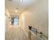 Bright entryway with geometric wallpaper and view into the living area at 1584 Sandbagger Dr, Davenport, FL 33896