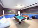Finished garage with pool table, foosball table, and seating at 1584 Sandbagger Dr, Davenport, FL 33896