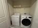 Convenient laundry room with washer and dryer at 1584 Sandbagger Dr, Davenport, FL 33896