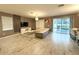 Living room with sectional sofa, access to pool, and large windows at 1584 Sandbagger Dr, Davenport, FL 33896