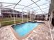 Inviting screened pool and spa at 1584 Sandbagger Dr, Davenport, FL 33896