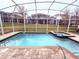 Inviting screened pool and spa at 1584 Sandbagger Dr, Davenport, FL 33896