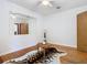 Bedroom with wooden floors, ceiling fan, and large mirror at 1601 Lyndale Blvd, Maitland, FL 32751