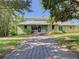 House with a walkway, landscaping, and a unique mural at 1601 Lyndale Blvd, Maitland, FL 32751