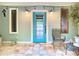 Inviting front porch with a teal door and string lights at 1601 Lyndale Blvd, Maitland, FL 32751