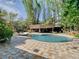 Beautiful kidney shaped pool with flagstone patio and tiki hut at 1601 Lyndale Blvd, Maitland, FL 32751