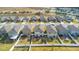 Aerial view of neighborhood backyards with fences, landscaping, and neat lawns at 1778 Sundance Chase Rd, Minneola, FL 34715