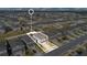 Aerial view of the property and surrounding neighborhood with landscaped lawns and fenced yards at 1778 Sundance Chase Rd, Minneola, FL 34715