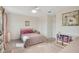 Cozy bedroom featuring a floral patterned comforter, area rug, ceiling fan and bright, neutral paint at 1778 Sundance Chase Rd, Minneola, FL 34715