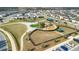 Aerial view of the community park, featuring playground equipment, shaded picnic areas and walking paths at 1778 Sundance Chase Rd, Minneola, FL 34715
