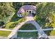 Aerial view of house showing large lot, circular driveway, and landscaping at 1829 Brackenhurst Pl, Lake Mary, FL 32746