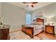 Elegant bedroom with wood flooring and an ensuite bathroom at 1829 Brackenhurst Pl, Lake Mary, FL 32746