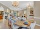 Formal dining room features a large table and views into adjacent rooms at 1829 Brackenhurst Pl, Lake Mary, FL 32746