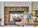 Elegant fireplace with marble surround and gas logs at 1829 Brackenhurst Pl, Lake Mary, FL 32746