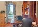 Home office with built-in bookshelves and plenty of natural light at 1829 Brackenhurst Pl, Lake Mary, FL 32746