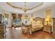 Spacious main bedroom with wood floors and a sitting area at 1829 Brackenhurst Pl, Lake Mary, FL 32746