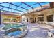 Inviting pool and spa area with covered patio and outdoor kitchen at 1829 Brackenhurst Pl, Lake Mary, FL 32746