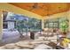 Spacious poolside patio with seating area and fire pit at 1829 Brackenhurst Pl, Lake Mary, FL 32746