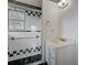 Updated bathroom featuring a glass-enclosed shower and a new vanity with ample storage at 1886 Elkcam Blvd, Deltona, FL 32725
