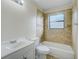 Well-lit bathroom with a tub-shower combo, modern toilet, and a vanity with bright white cabinets at 1886 Elkcam Blvd, Deltona, FL 32725