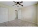 Bedroom with tile flooring, ceiling fan, and closet at 1886 Elkcam Blvd, Deltona, FL 32725