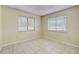 Bedroom with tile floors and dual windows allowing for ample natural light at 1886 Elkcam Blvd, Deltona, FL 32725