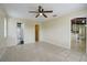 Bright bedroom with tile flooring, ceiling fan, and easy access to the bathroom and kitchen at 1886 Elkcam Blvd, Deltona, FL 32725