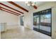 Open dining area with exposed beams and access to screened lanai at 1886 Elkcam Blvd, Deltona, FL 32725